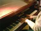 Peretti's hands on piano